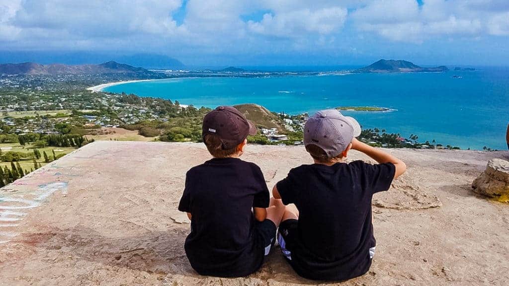 two boys looking out at ocean from Lanikai Pillbox Hike