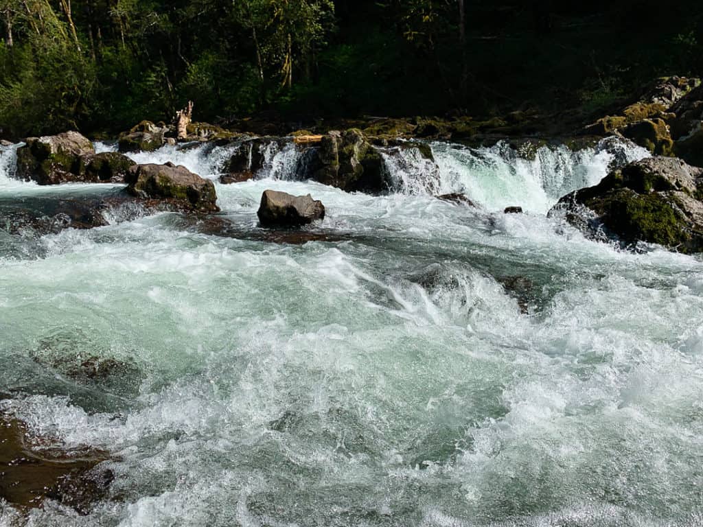 white water cascading over rocks in river