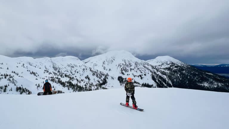 father and son snowboarders at top of eaglecrest ski area