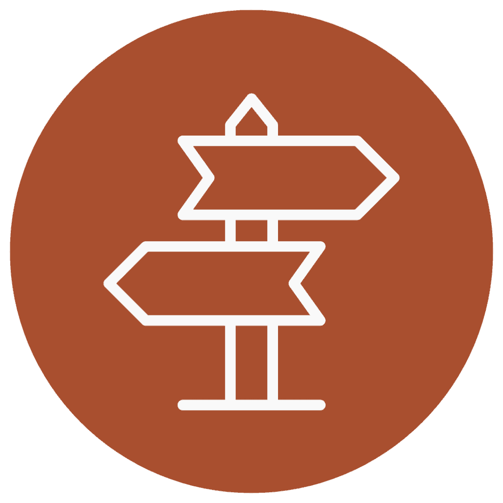 white arrow sign points two directions on orange background