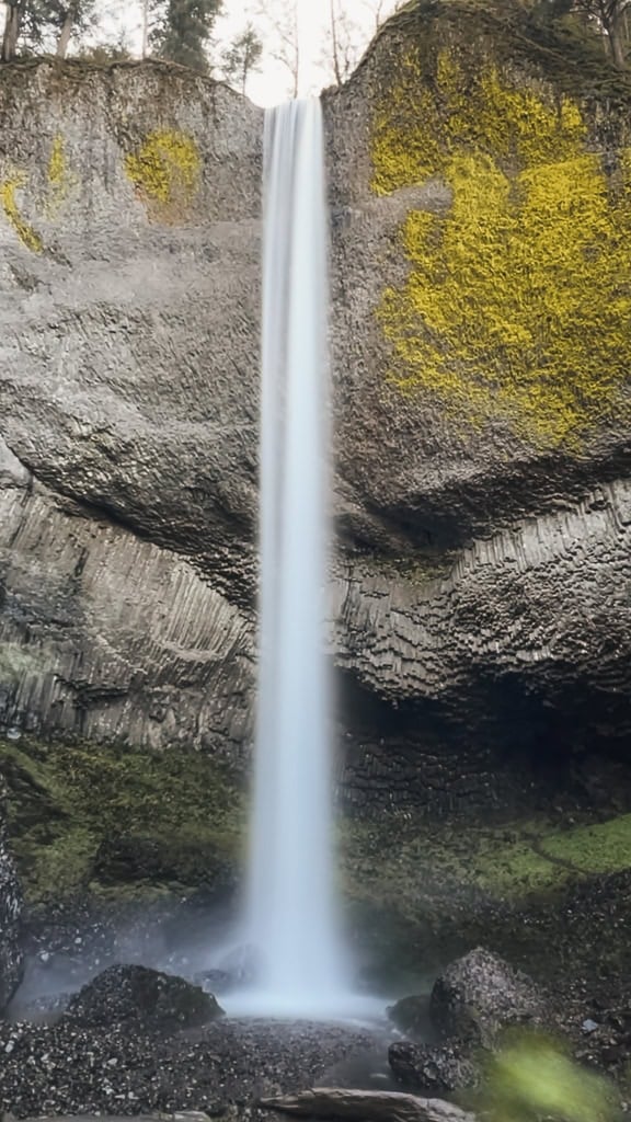 Multnomah Falls Guide: What to Know About Visiting Oregon’s Tallest Waterfall 4 Latourell Falls plunges in a single, narrow stream from a high basalt cliff covered in bright green moss. Located near Multnomah Falls, this striking waterfall is known for its unique columnar basalt formations and dramatic vertical drop.